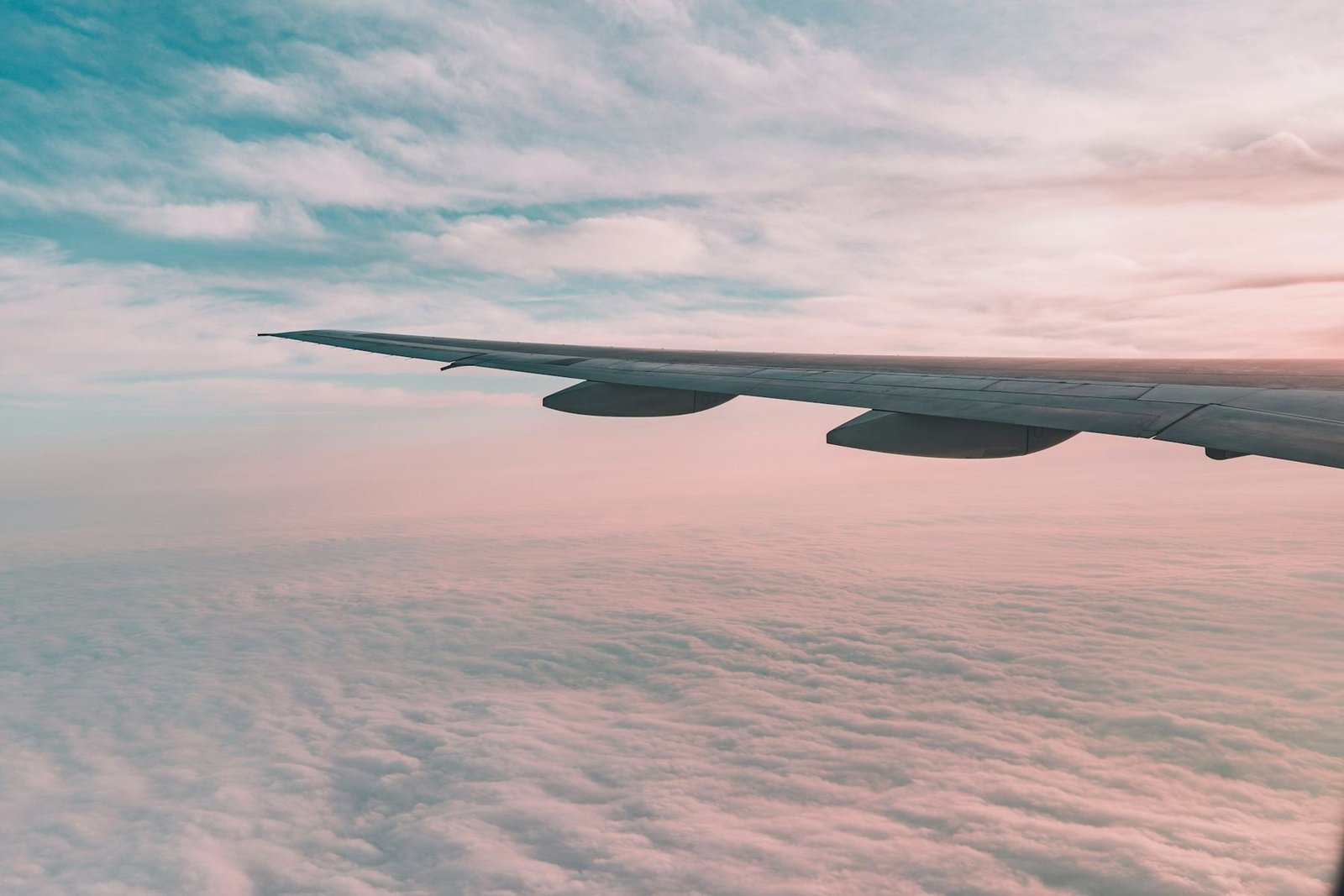 The wing of an aircraft above the clouds